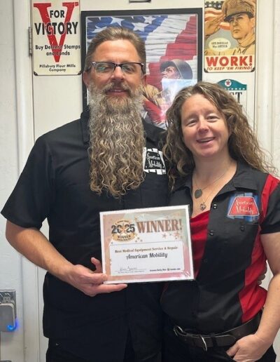 Owners holding a plaque